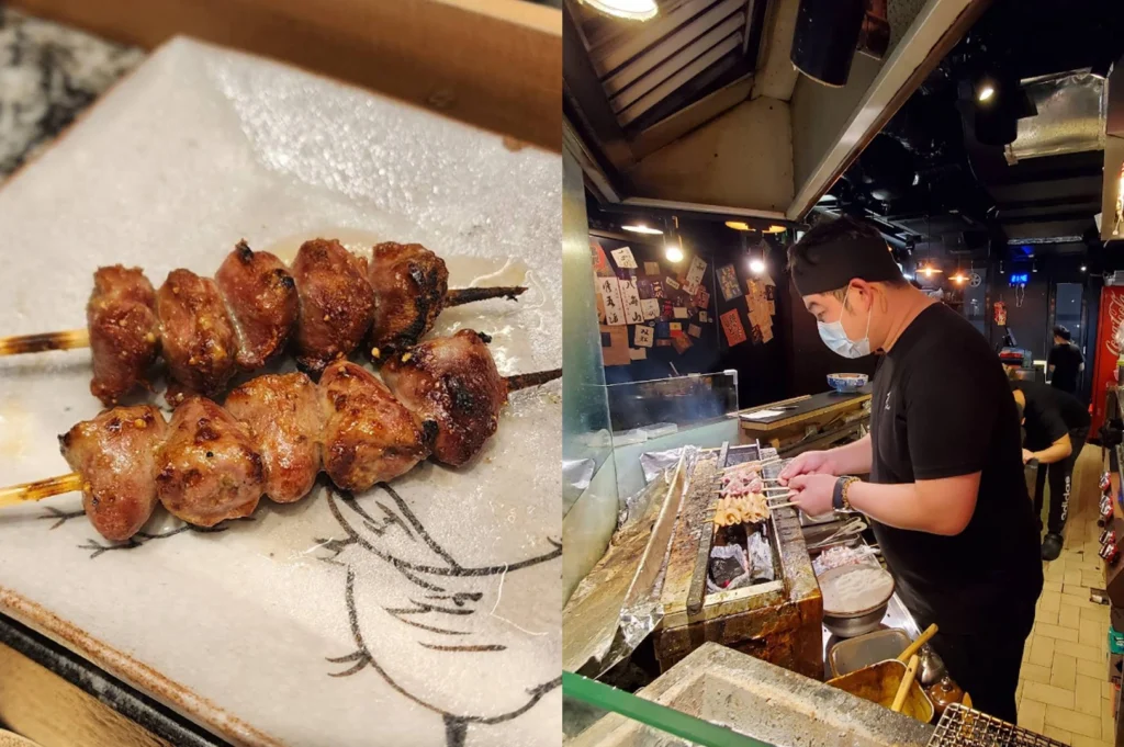 This split-screen image showcases both the final product and the cooking process: on the left, a close-up reveals two skewers of charred, succulent chicken hearts resting on a ceramic plate decorated with a bird illustration; on the right, a chef in a black cap and face mask leans over a glowing charcoal grill in a narrow, atmospheric izakaya decorated with traditional wooden calligraphy plaques.