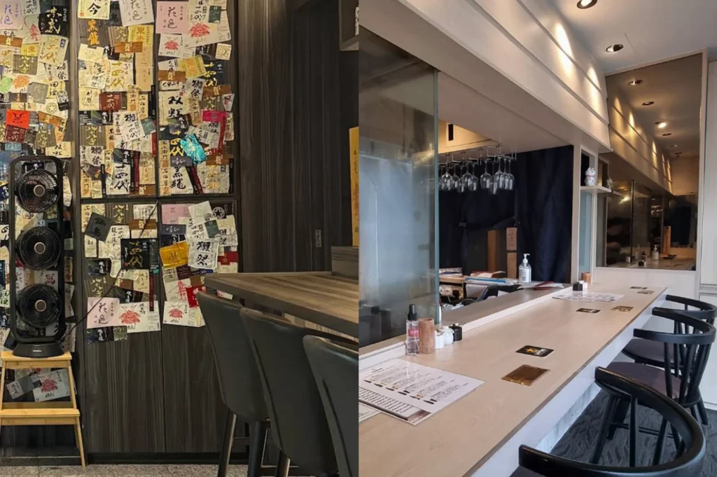 The final split-screen captures the decorative and functional elements of the two restaurants. The left side shows a dark wood wall completely covered in various colorful Japanese sake labels, creating a textured, collage-like effect next to a stack of three black circular fans on a wooden stool. The right side provides a perspective view down a long, empty light-wood bar counter. The space is illuminated by recessed ceiling lights, showing a neat setup of menus and coasters, with a small beckoning cat (maneki-neko) figurine sitting on a shelf near the kitchen curtain.