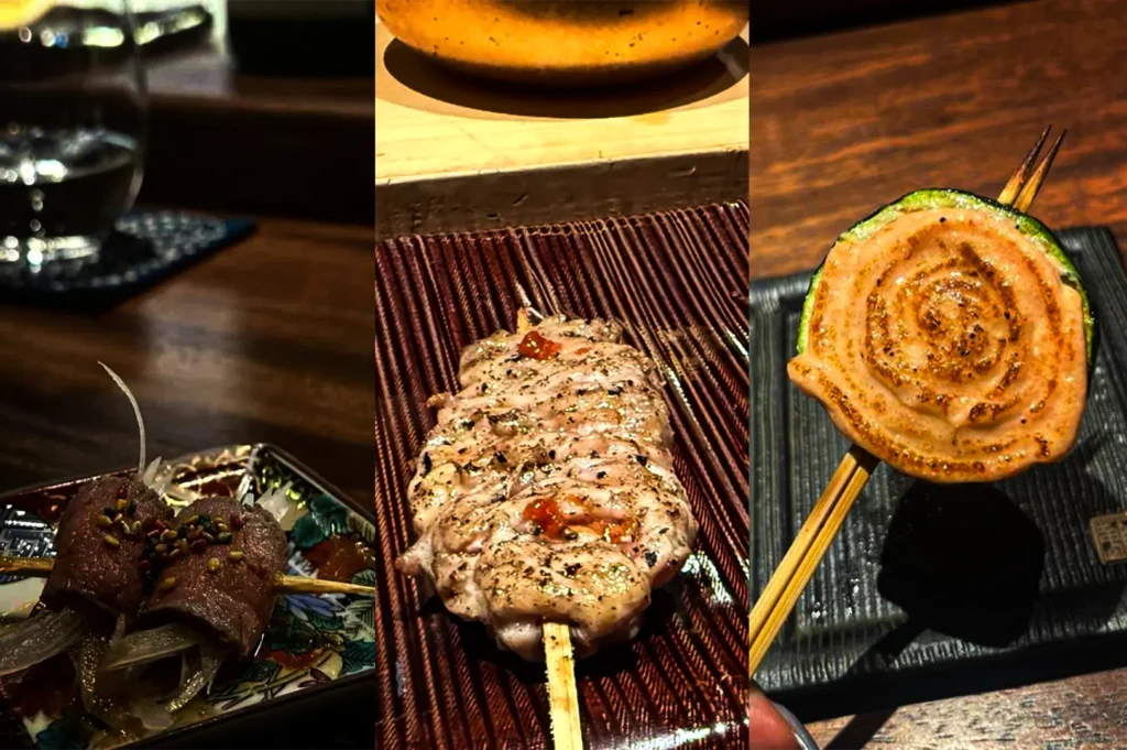 Three close-up dishes of grilled skewers arranged side by side on a dark wooden table. The left dish features skewered meat topped with sesame seeds and sliced onions, the center shows a grilled chicken skewer seasoned with herbs and sauce, and the right displays a spiral-wrapped grilled skewer with a lightly charred surface.